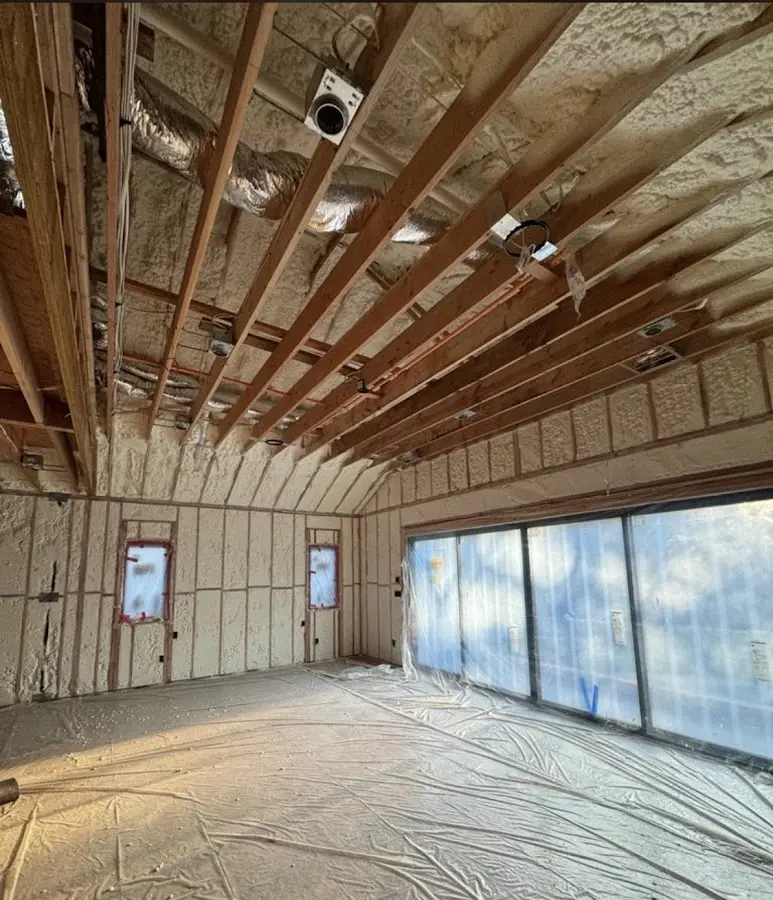 Interior walls and ceiling insulated with spray foam during new construction in Highland City